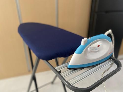 a blue and white computer mouse sitting on a chair at City Clou in Cebu City