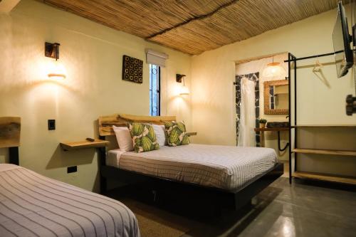 Giường trong phòng chung tại Jungla EcoLuxury Resort