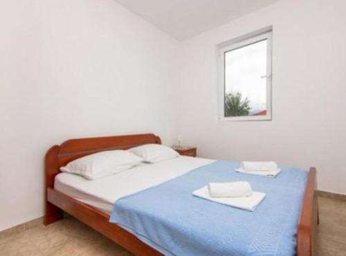 Ένα ή περισσότερα κρεβάτια σε δωμάτιο στο Apartments Savić near the Sea