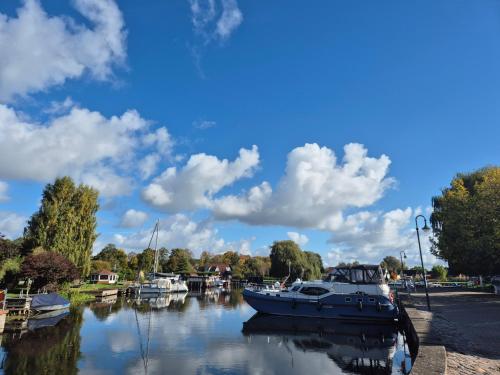a boat is docked at a marina on the water at Appelgriebsch in Neukalen
