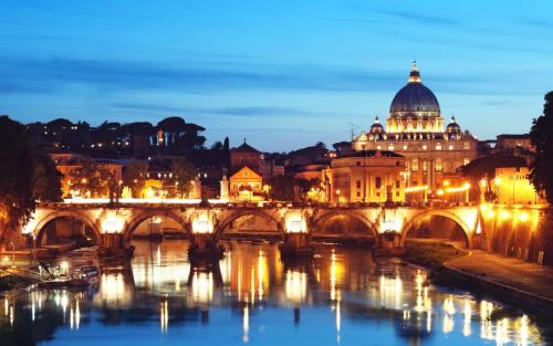 a bridge over the river nervi at night at Pianeta Roma 127 in Rome