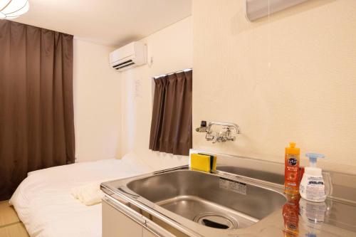 Postel nebo postele na pokoji v ubytování Kawagoe good place House