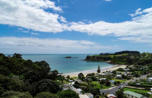 an aerial view of a beach and the ocean at Island View - Stay Waiheke in Palm Beach