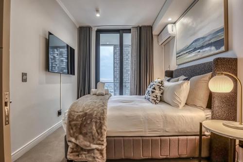 En eller flere senge i et værelse på Stormside at Ellipse