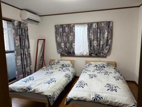 Postel nebo postele na pokoji v ubytování Guest House Hana