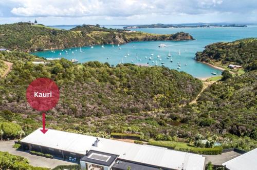 an aerial view of kent island with a marina at Delamore Cove - Kauri - Stay Waiheke in Matiatia Bay