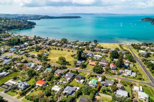 an aerial view of a suburb next to the water at Bach 14 - Stay Waiheke in Blackpool
