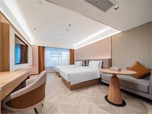 En eller flere senge i et værelse på Starway Hotel Chengdu Wuhouci Hongpailou Subway Station