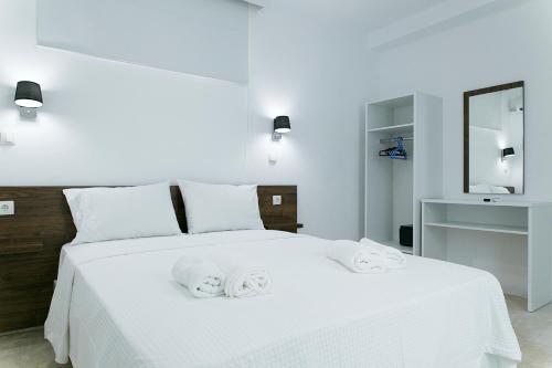 Кровать или кровати в номере Kissamia Rooms - Next to Night Clubs