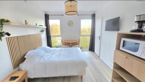 Ένα ή περισσότερα κρεβάτια σε δωμάτιο στο Studio Cosy 1pers