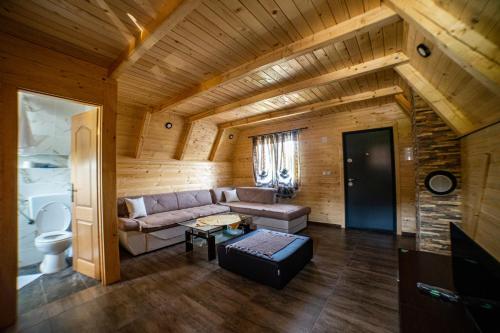 a living room with a couch and a table at Una Relax in Vajagići