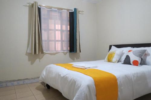 Postel nebo postele na pokoji v ubytování Gratia Pad Nanyuki