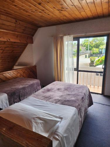 Postelja oz. postelje v sobi nastanitve Papakura Crusoe's motor lodge