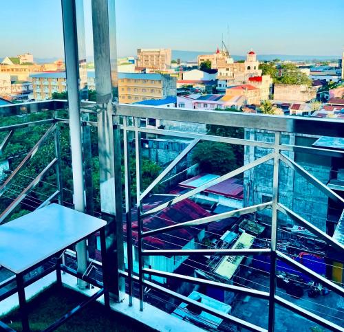 a view of a city from the balcony of a building at Naga City River View 2BR UB Apartment in Naga