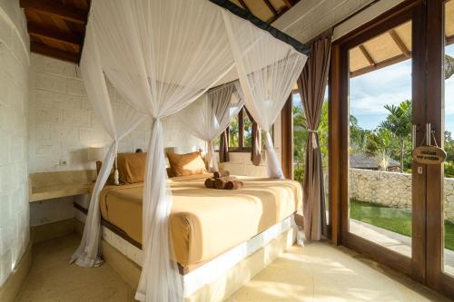 Giường trong phòng chung tại Biu Biu Resort Bali