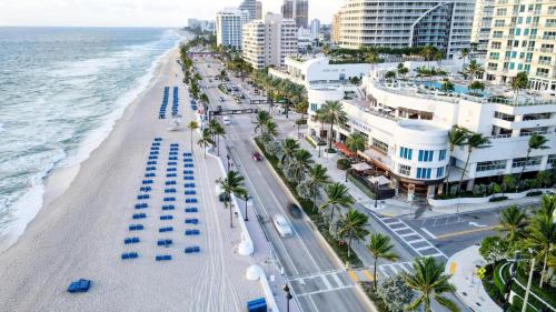 an aerial view of a beach with buildings and the ocean at Beach House Fort Lauderdale, A Hilton Resort in Fort Lauderdale