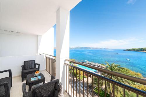 a balcony with a view of the ocean at Hotel Moré in Alcudia