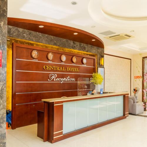 a lobby of a hotel with a reception desk at Central Hotel in Móng Cái