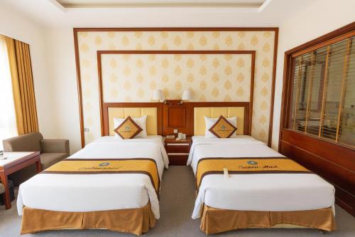 Кровать или кровати в номере Central Hotel