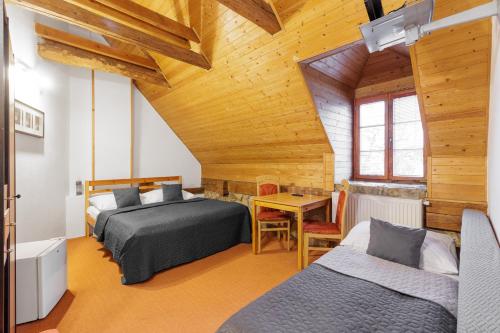 Postel nebo postele na pokoji v ubytování Hotel BELLA