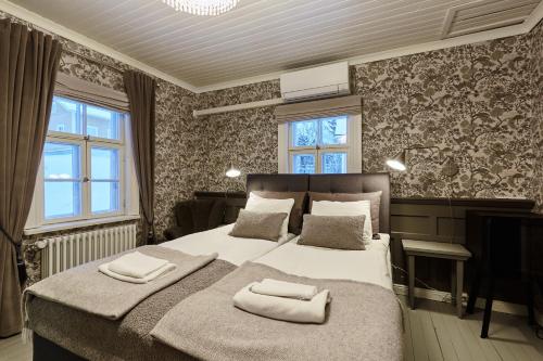 Postel nebo postele na pokoji v ubytování Finlandia Hotel Puu-Juuka