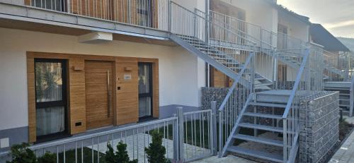 a staircase leading up to a building with a house at Kasztanowy Zakątek in Szczyrk