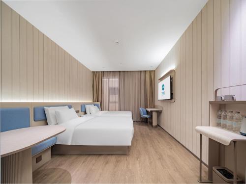 Postel nebo postele na pokoji v ubytování Hanting Hotel Chengdu Tianfu Square Chunxi Road