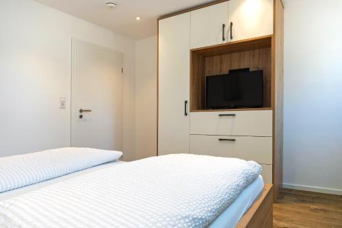 Postel nebo postele na pokoji v ubytování Klosterhof Aue W 5