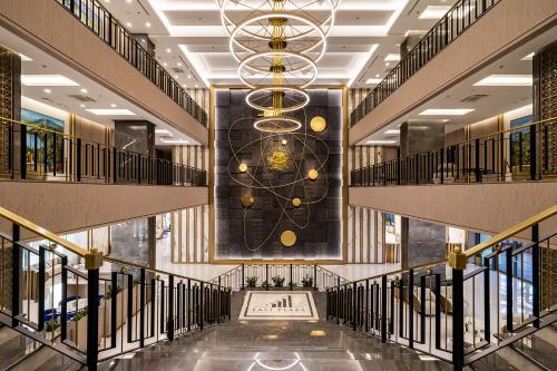 a view of a lobby with a large clock on the wall at East Plaza Hotel in Sofia