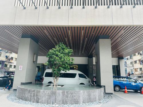 a white van parked in front of a building at Bukit Bintang Suites KL in Kuala Lumpur