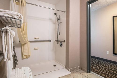 a bathroom with a shower and a toilet at Quality Inn & Suites Missoula Westside in Missoula