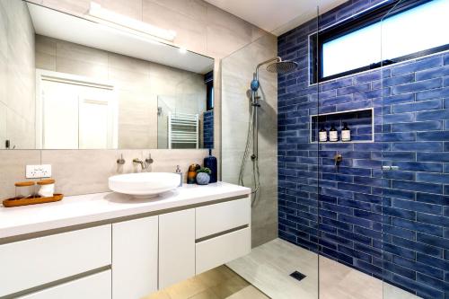 a bathroom with a sink and a shower at Bali Hi Walk to Beach in Balnarring Beach