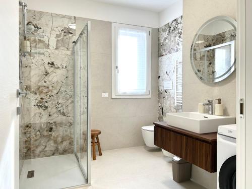 a bathroom with a shower and a sink at Malpensa Airport Apartment - 9 min to MXP - Free Parking in Somma Lombardo