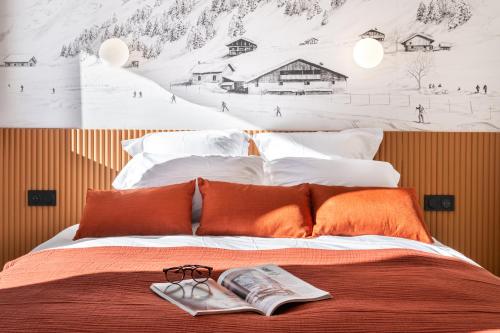 En eller flere senge i et værelse på Appartement 3P chic ski-in and out - Val Thorens