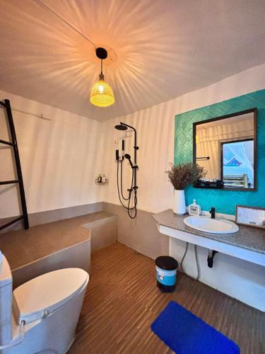 a bathroom with a toilet and a sink at Sense Asia in Haad Tian