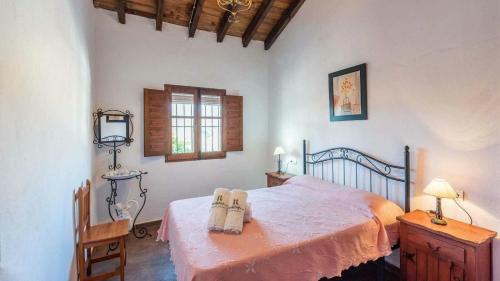 En eller flere senge i et værelse på Casa El Cerro El Borge by Ruralidays