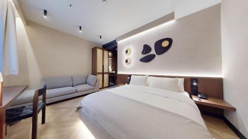 Postel nebo postele na pokoji v ubytování Hotel Trianon