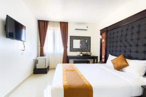 Postel nebo postele na pokoji v ubytování HỒNG ANH 1 HOTEL