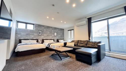 Postel nebo postele na pokoji v ubytování FUKUOKA MOJIKO STAY