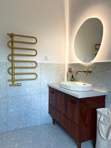 a bathroom with a sink and a mirror at Na Pańskim in Klimkówka