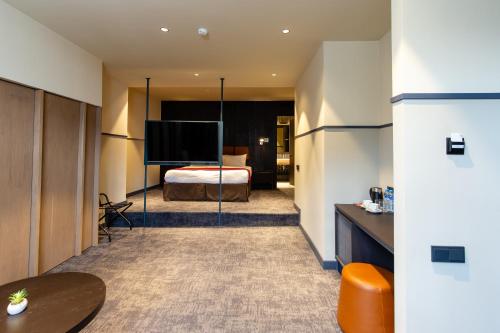 Postel nebo postele na pokoji v ubytování Hotel NOBO Tbilisi