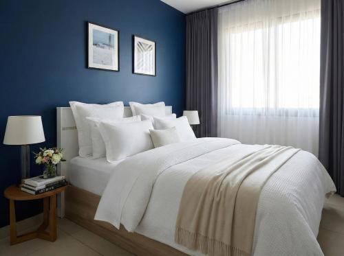 Ένα ή περισσότερα κρεβάτια σε δωμάτιο στο Unixx south pattaya - high floor sea view 2 bedrooms