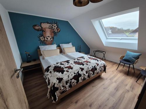 a bedroom with a bed with a cow head on the wall at FeWo Zenk Stublang in Bad Staffelstein