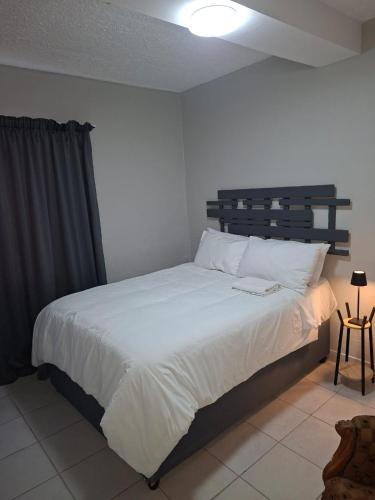 Postel nebo postele na pokoji v ubytování Grace Villas 1