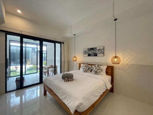 Giường trong phòng chung tại Gede Awan Guesthouse