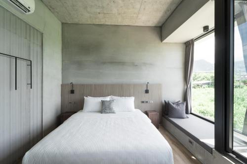 Ένα ή περισσότερα κρεβάτια σε δωμάτιο στο Mr-M都蘭