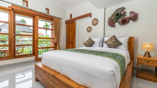 En eller flere senge i et værelse på Khandra Kutuh