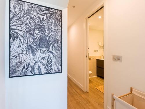 a hallway with a drawing on the wall in a house at Blue Horizon Retreat in Playa del Aguila