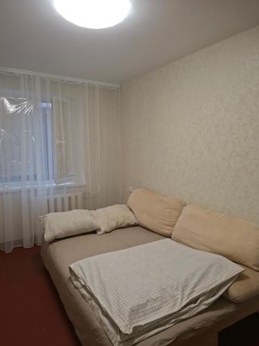 En eller flere senge i et værelse på Cozy apartment