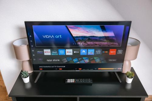 TV a/nebo společenská místnost v ubytování City Apartment